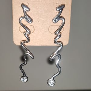 Unique 2" silver earrings with diamond accent